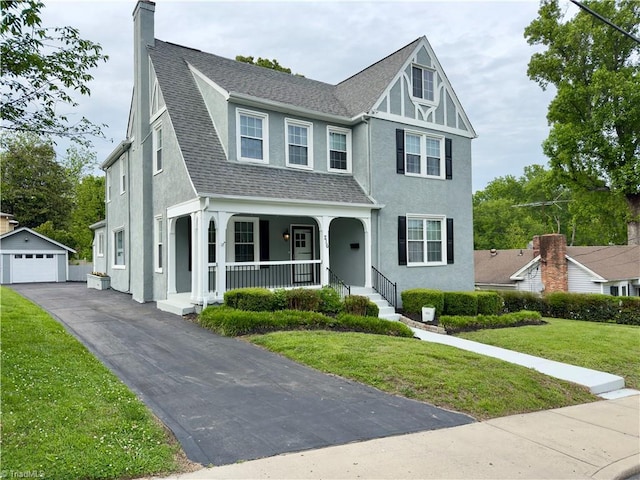 216 Rawley Ave, Mount Airy, NC 27030 - view of front of home featuring a porch, an outdoor structure, stucco siding, a chimney, and a front yard