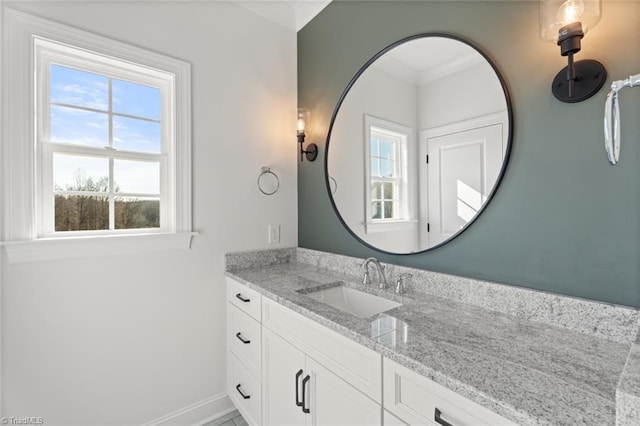 bathroom with vanity and baseboards