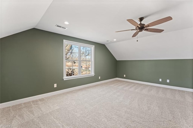 additional living space with recessed lighting, carpet flooring, a ceiling fan, baseboards, and vaulted ceiling