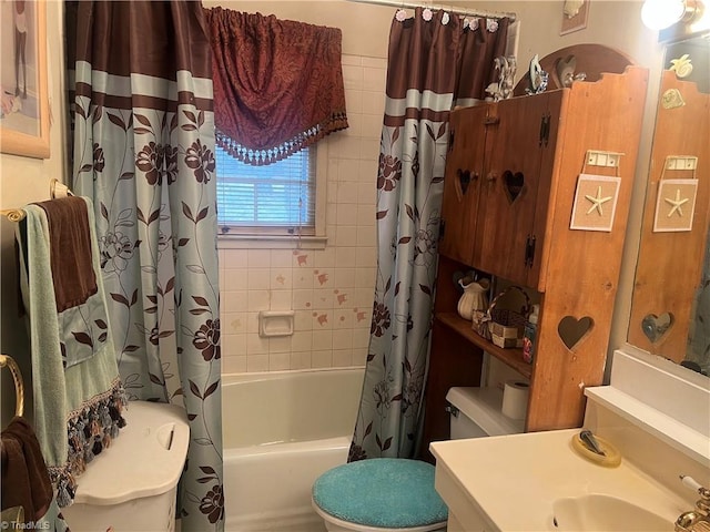 full bathroom with toilet, shower / bathtub combination with curtain, and vanity