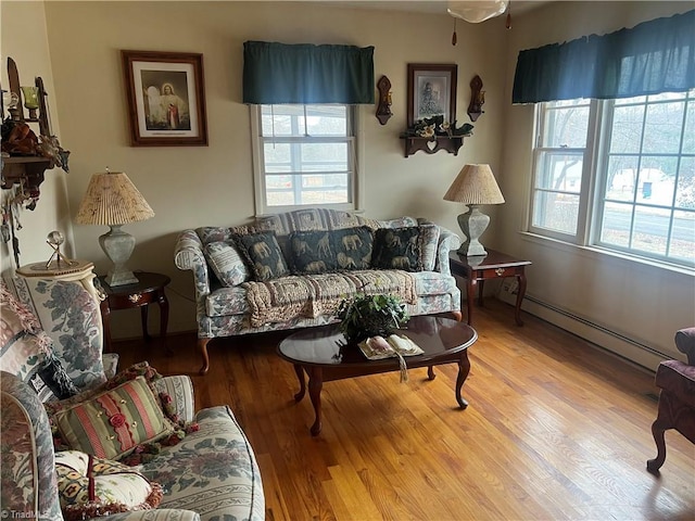 living room featuring light hardwood / wood-style floors and a baseboard radiator