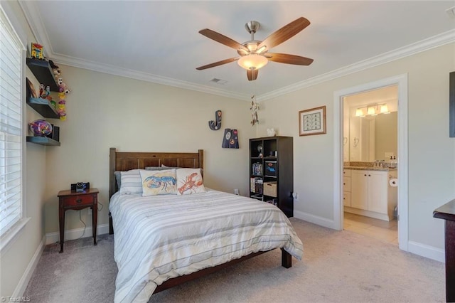 carpeted bedroom featuring crown molding, ceiling fan, and ensuite bath