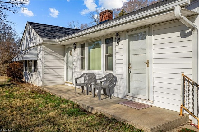 doorway to property featuring a yard