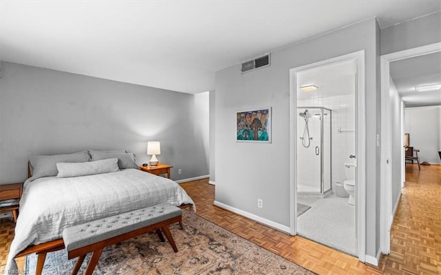 bedroom featuring parquet floors and ensuite bath