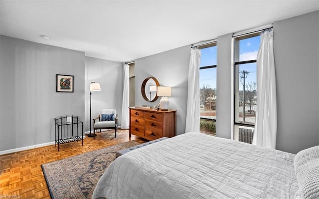 bedroom with light parquet floors