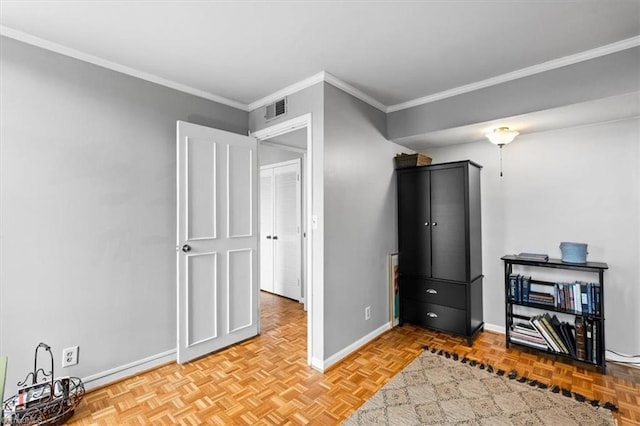 interior space featuring ornamental molding and light parquet flooring