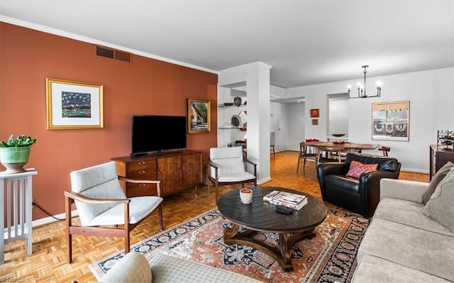 living room with parquet floors, a notable chandelier, and ornamental molding