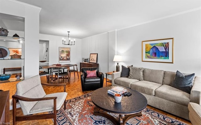 living room featuring parquet flooring, ornamental molding, and a chandelier