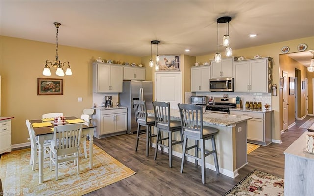 416 Bryson Blvd, Lexington, NC 27295 - kitchen featuring stainless steel appliances, dark wood-type flooring, a center island, pendant lighting, and recessed lighting