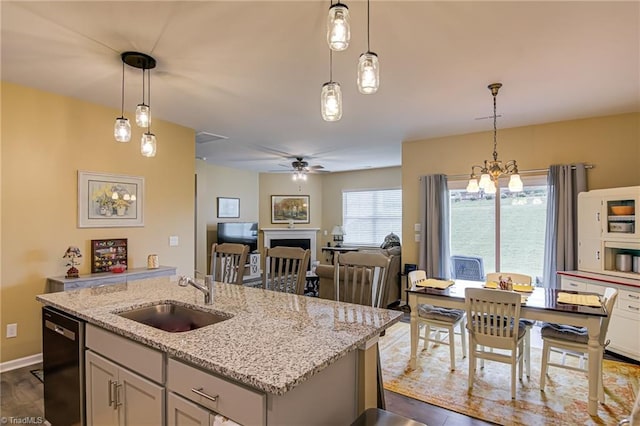 416 Bryson Blvd, Lexington, NC 27295 - kitchen with dishwasher, a fireplace, dark wood-style flooring, open floor plan, and an island with sink