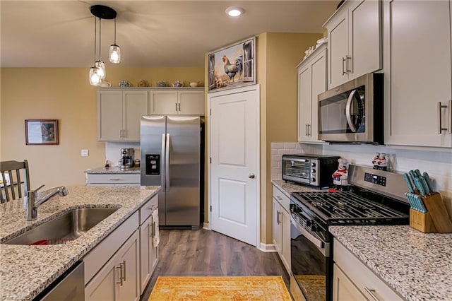 416 Bryson Blvd, Lexington, NC 27295 - kitchen featuring appliances with stainless steel finishes, dark wood-style flooring, hanging light fixtures, recessed lighting, and light stone countertops