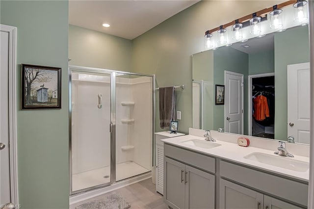 416 Bryson Blvd, Lexington, NC 27295 - full bathroom featuring a stall shower, double vanity, and a walk in closet