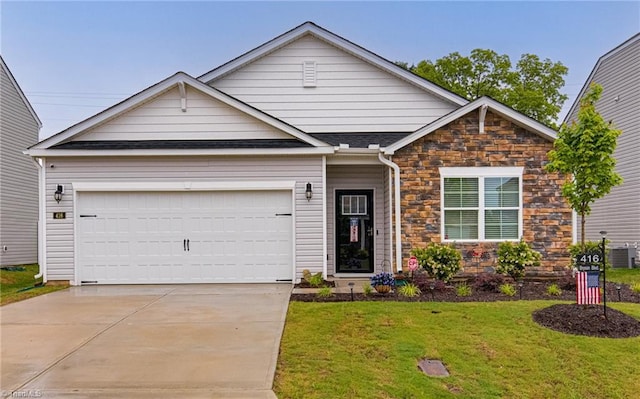 416 Bryson Blvd, Lexington, NC 27295 - view of front of home with stone siding, driveway, a front lawn, and an attached garage