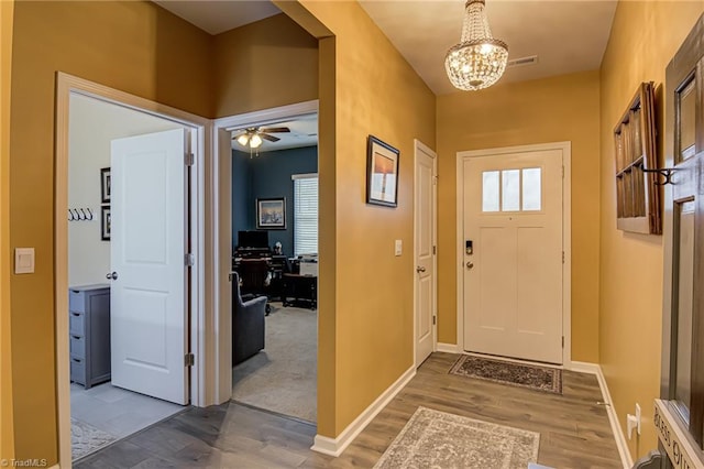 416 Bryson Blvd, Lexington, NC 27295 - entryway with wood finished floors, a chandelier, and a ceiling fan