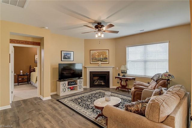 416 Bryson Blvd, Lexington, NC 27295 - living room featuring ceiling fan, dark wood finished floors, and a glass covered fireplace