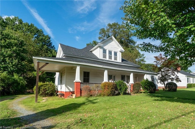 view of front facade with a front lawn and a porch