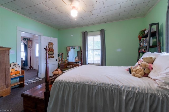 bedroom with dark carpet