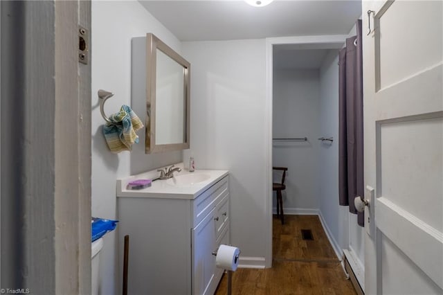 bathroom with vanity and hardwood / wood-style flooring