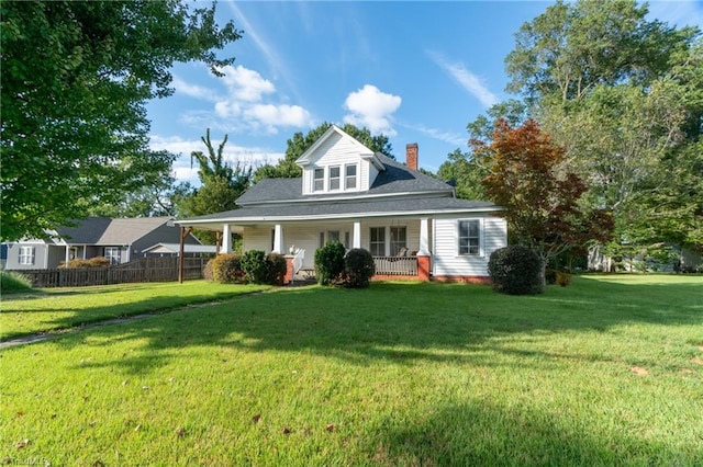 view of front of property featuring a porch and a front yard