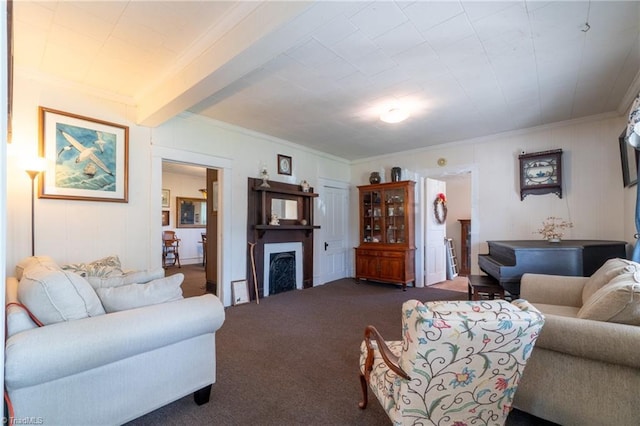 living room with ornamental molding, beamed ceiling, and carpet