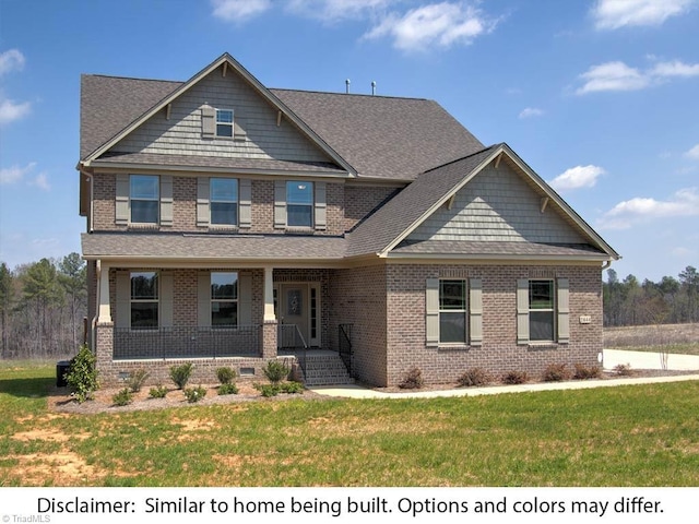 craftsman inspired home with brick siding, covered porch, and a front lawn