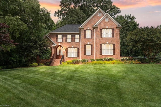 4607 Eden Bridge Dr, Kernersville, NC 27284 - view of front of property with a front yard and brick siding