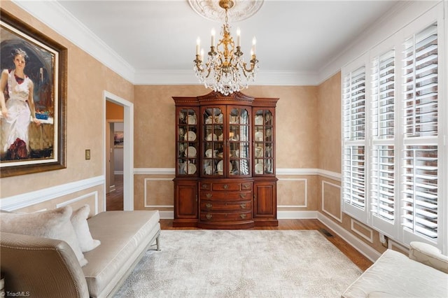 4607 Eden Bridge Dr, Kernersville, NC 27284 - sitting room with a chandelier, wood finished floors, wainscoting, and crown molding