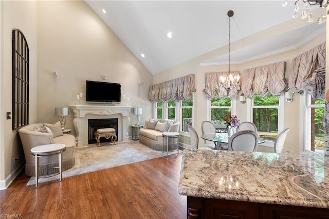4607 Eden Bridge Dr, Kernersville, NC 27284 - kitchen with a chandelier, wood finished floors, high vaulted ceiling, light stone counters, and recessed lighting