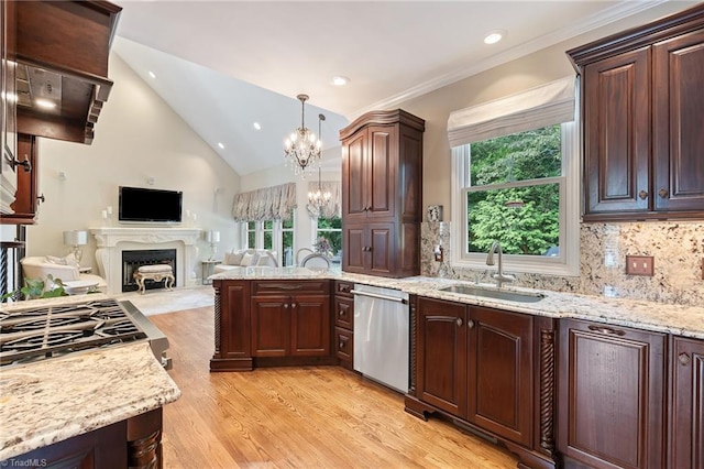 4607 Eden Bridge Dr, Kernersville, NC 27284 - kitchen featuring dishwasher, open floor plan, light wood-style flooring, a fireplace, and a chandelier