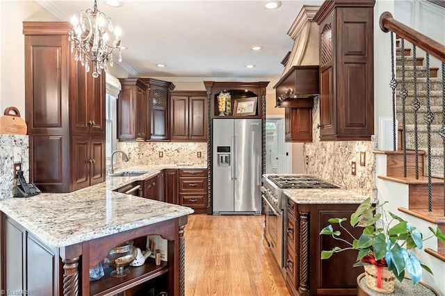 4607 Eden Bridge Dr, Kernersville, NC 27284 - kitchen featuring appliances with stainless steel finishes, open shelves, light stone countertops, a peninsula, and decorative light fixtures
