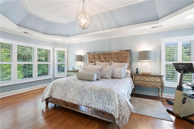 4607 Eden Bridge Dr, Kernersville, NC 27284 - bedroom featuring ornamental molding, a chandelier, wood finished floors, and a tray ceiling