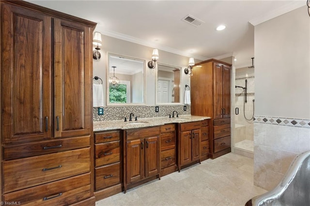 4607 Eden Bridge Dr, Kernersville, NC 27284 - full bathroom with a shower stall, double vanity, crown molding, recessed lighting, and tile walls