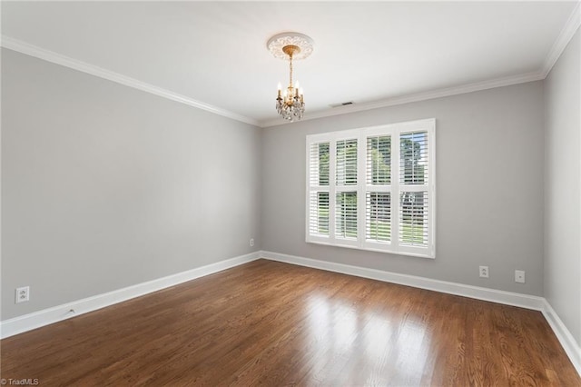 4607 Eden Bridge Dr, Kernersville, NC 27284 - spare room with a chandelier, crown molding, and dark wood finished floors