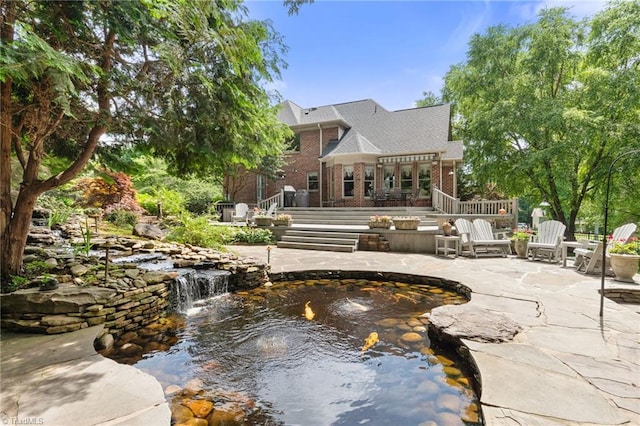 4607 Eden Bridge Dr, Kernersville, NC 27284 - surrounding community with a garden pond, a patio area, a pergola, and a deck