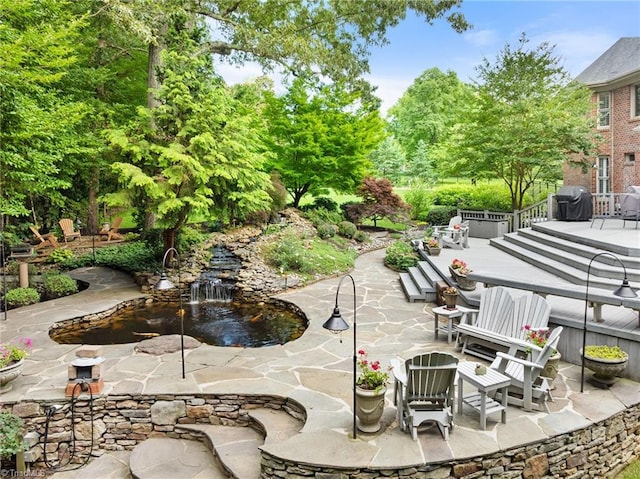 4607 Eden Bridge Dr, Kernersville, NC 27284 - view of patio / terrace featuring a garden pond