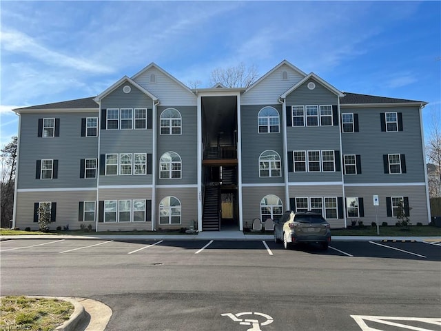 2607 Pennoak Way Unit H, Greensboro, NC 27407 - view of property featuring uncovered parking