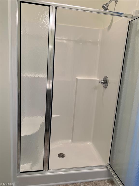 2607 Pennoak Way Unit H, Greensboro, NC 27407 - bathroom with a shower stall