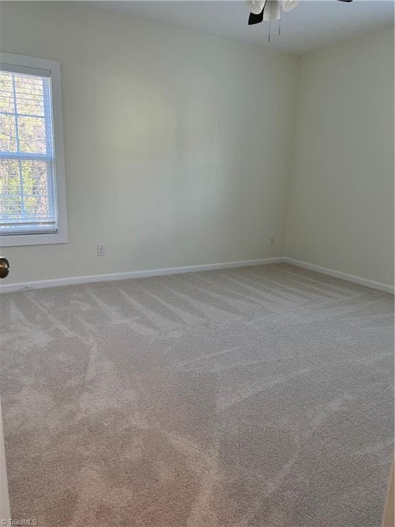 2607 Pennoak Way Unit H, Greensboro, NC 27407 - carpeted spare room featuring ceiling fan and baseboards
