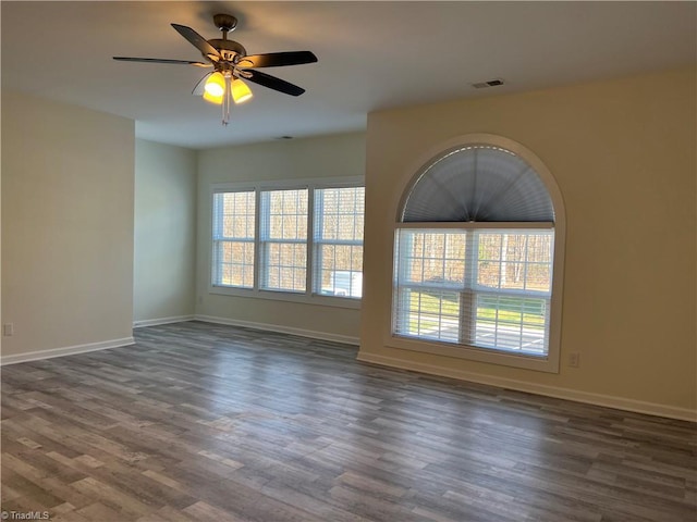 2607 Pennoak Way Unit H, Greensboro, NC 27407 - empty room with dark wood finished floors and a ceiling fan