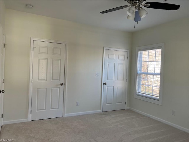 2607 Pennoak Way Unit H, Greensboro, NC 27407 - unfurnished bedroom featuring light carpet and a ceiling fan