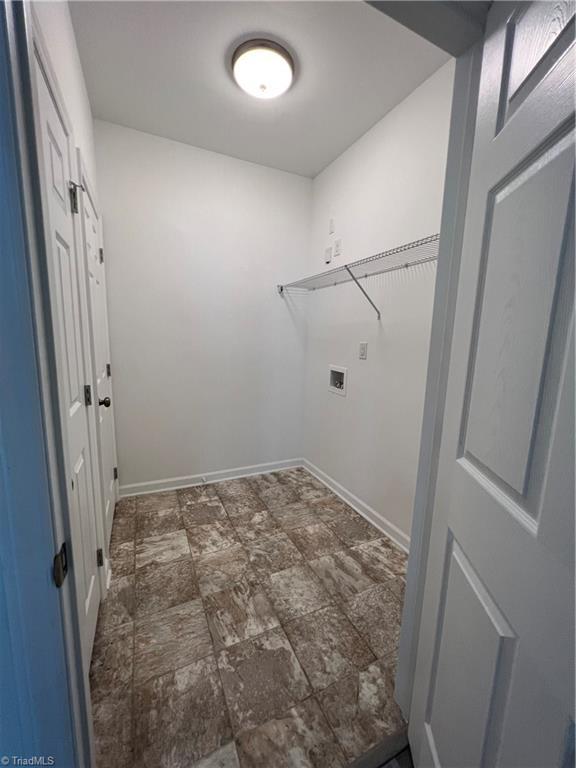 2607 Pennoak Way Unit H, Greensboro, NC 27407 - laundry area featuring washer hookup and stone finish flooring