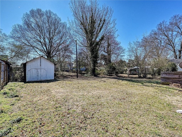 view of yard featuring an outbuilding and a storage unit