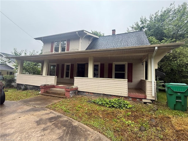 302 Louise Ave, High Point, NC 27262 - view of front facade featuring covered porch, a chimney, and a shingled roof