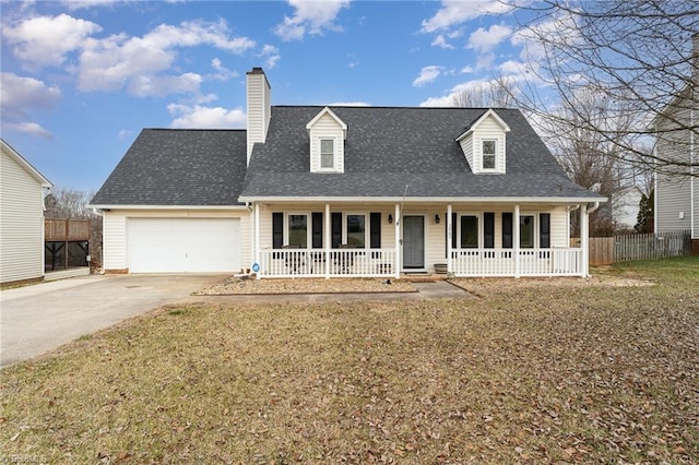 cape cod house featuring a garage, a front lawn, and a porch