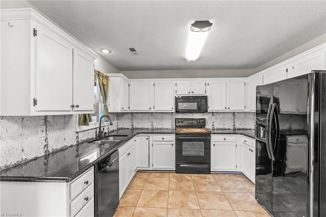 kitchen with white cabinets, light tile patterned floors, sink, and black appliances