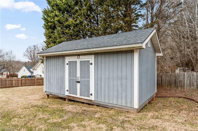 view of outdoor structure featuring a lawn