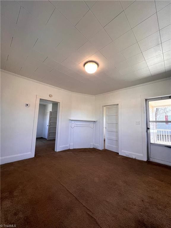 unfurnished bedroom with dark carpet