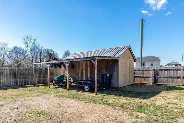 view of outbuilding featuring an outdoor structure and a fenced backyard