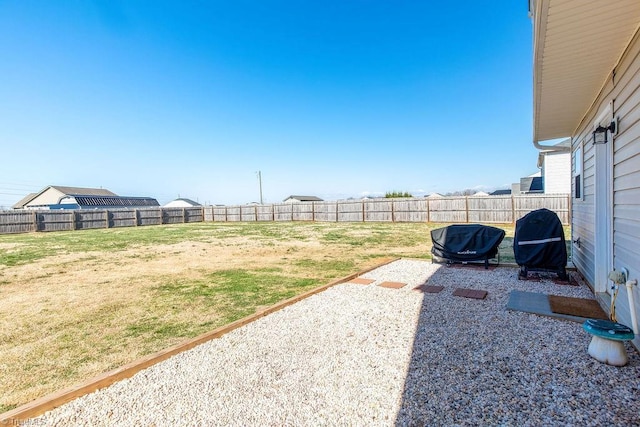 view of yard with a patio area and a fenced backyard