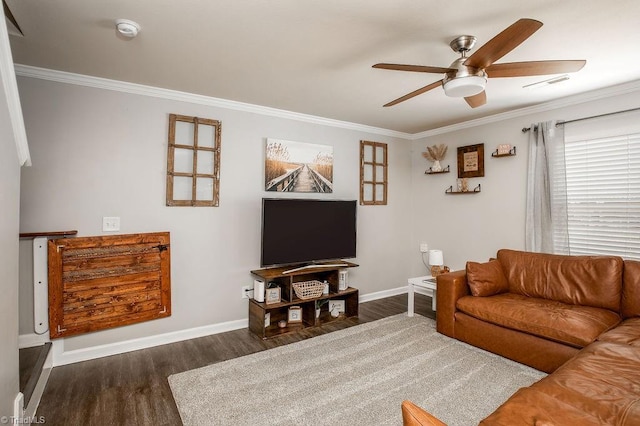 living room featuring visible vents, ornamental molding, wood finished floors, baseboards, and ceiling fan